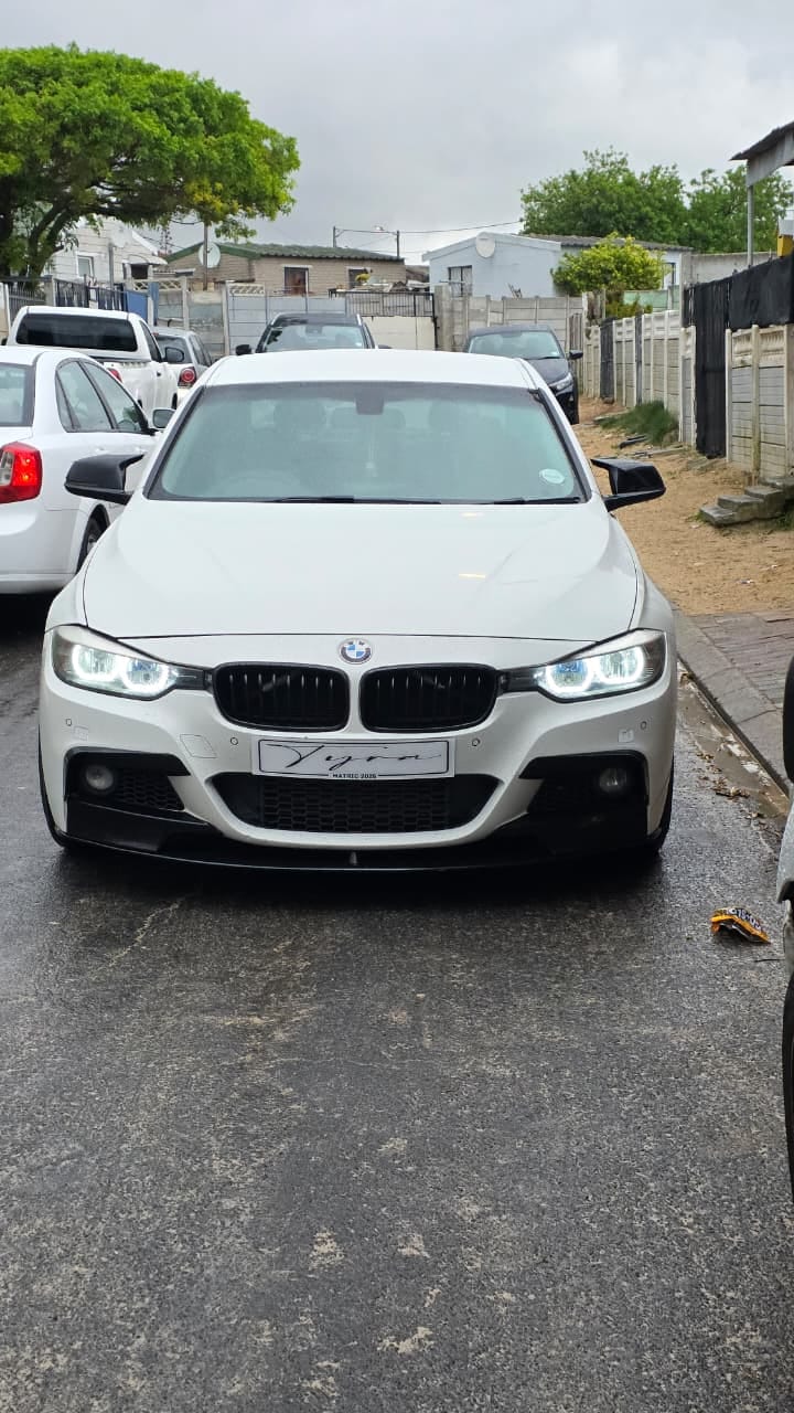 White BMW 3 Series with a matric name plate ready for a collection