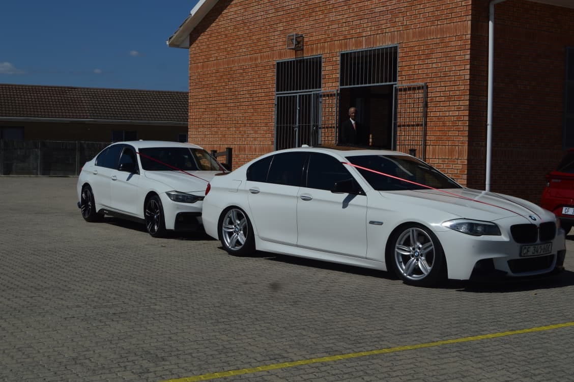 White BMW wedding cars waiting outside a church in Cape Town